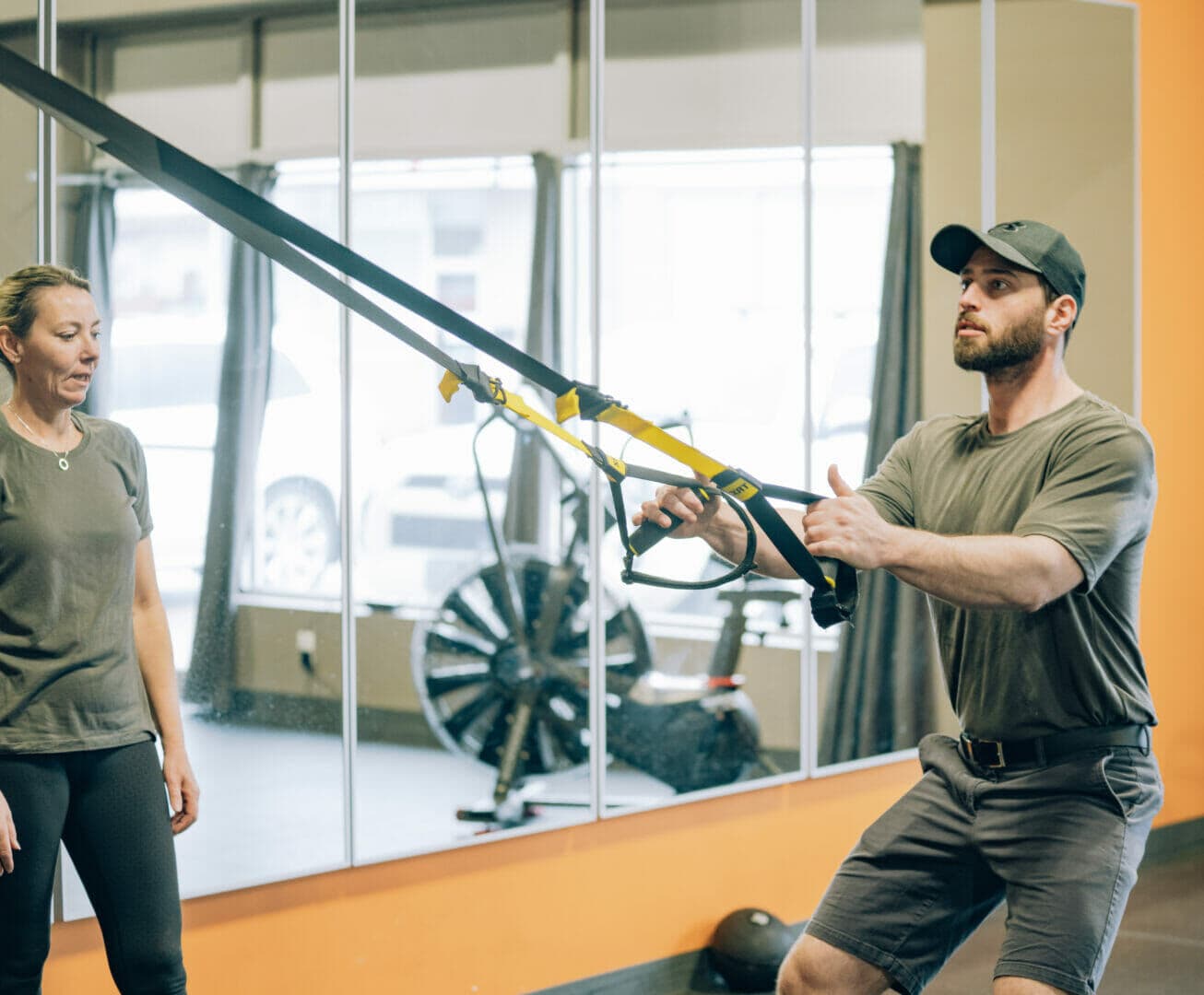 A coach working with a client in a small group session